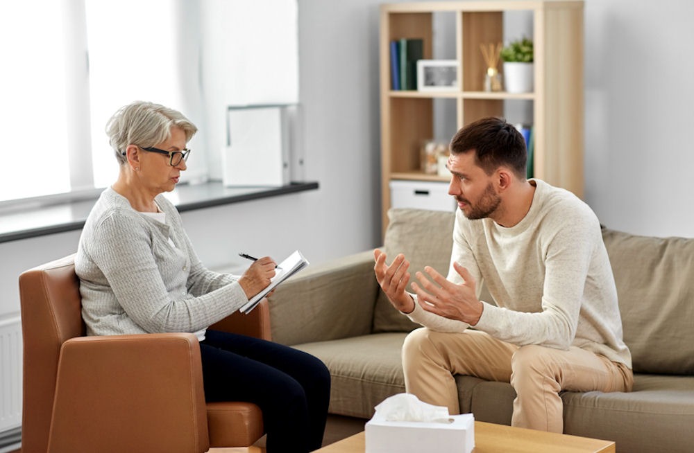 man talking to therapist in individual therapy