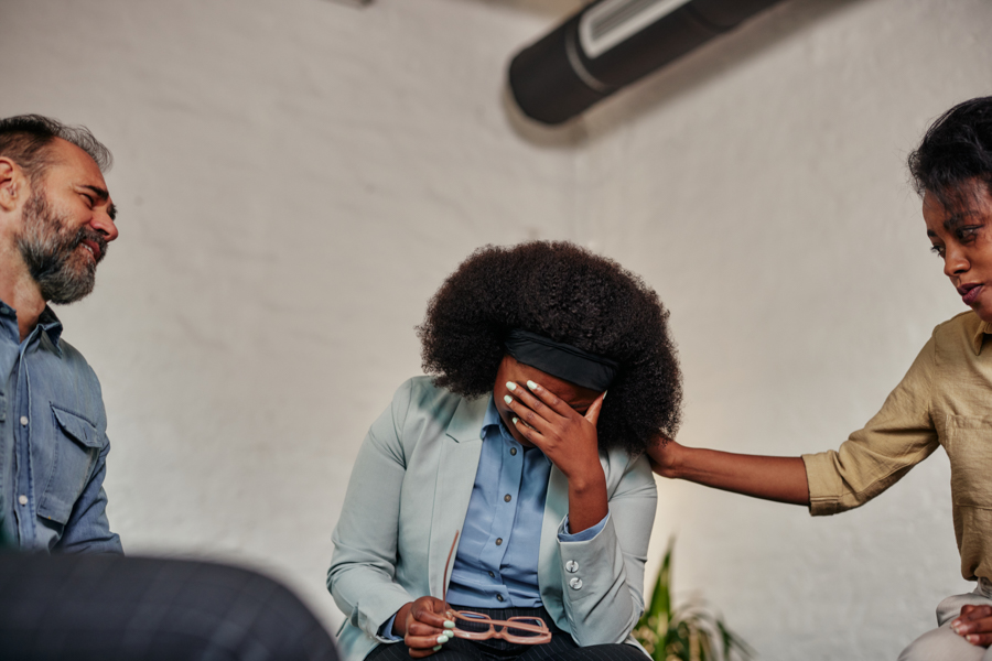 woman not feeling well with her hand over her face