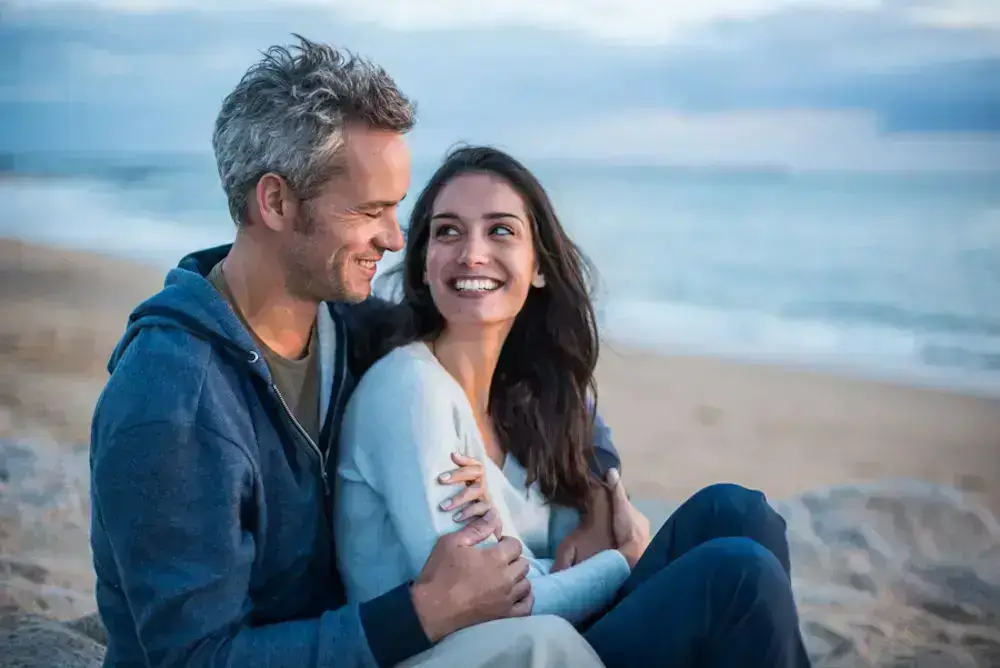 couple smiling at beach