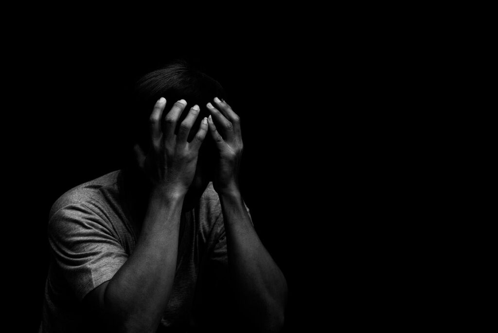 man experiencing anxiety and dissociation